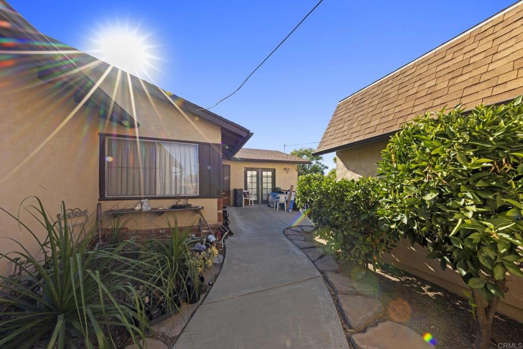 8552 Brodie Lane Santee, CA 92071 - Photo 13 of 40 a front view of a house with garden