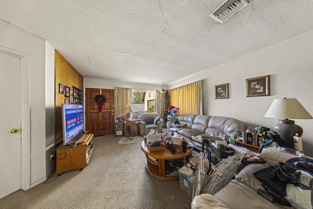 8552 Brodie Lane Santee, CA 92071 - Photo 23 of 40 a living room with furniture and a flat screen tv