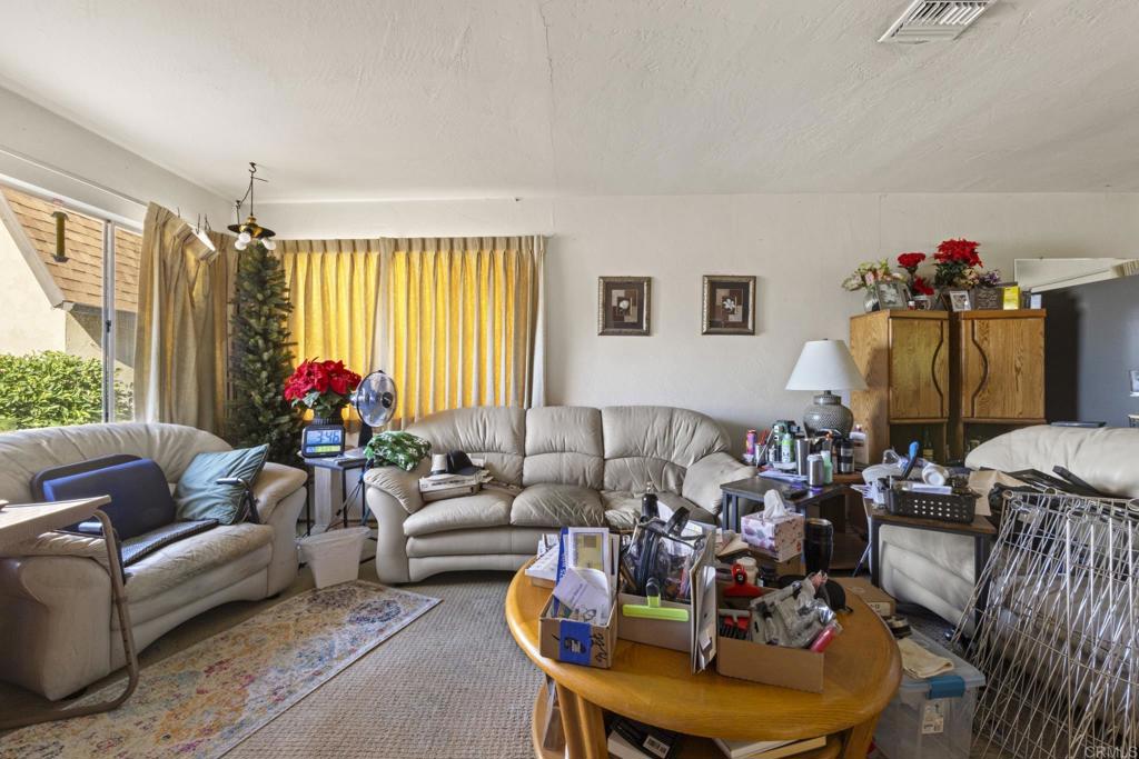 8552 Brodie Lane Santee, CA 92071 - Photo 24 of 40 a living room with furniture and a large window
