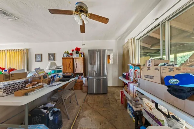 a kitchen with stainless steel appliances a sink stove and a refrigerator