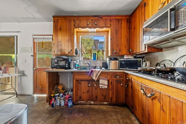 a bathroom with a sink a mirror and shower