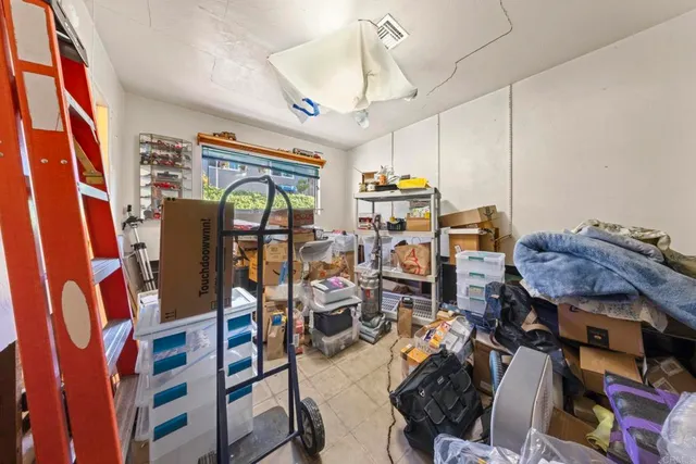 a bedroom with bed and a window