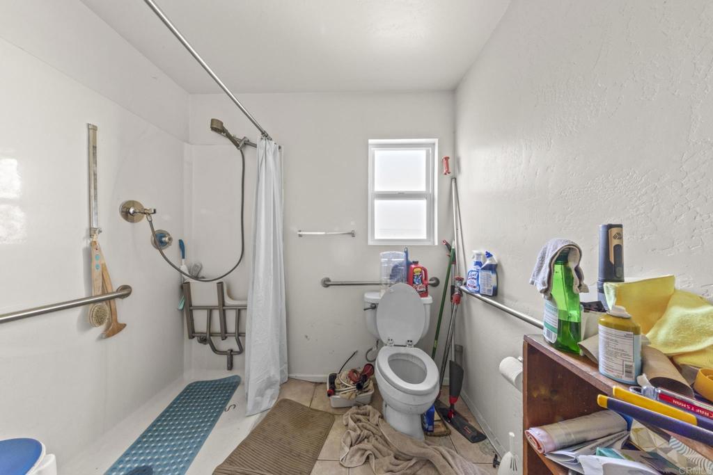 8552 Brodie Lane Santee, CA 92071 - Photo 38 of 40 a bathroom with a sink mirror vanity and toilet