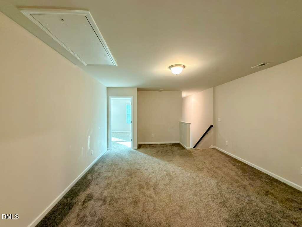 1152 Chestnut Bluff Run Apex, NC 27502 - Photo 17 of 35 a view of an empty room