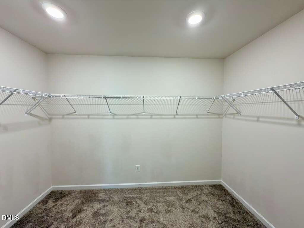 1152 Chestnut Bluff Run Apex, NC 27502 - Photo 25 of 35 a view of a room with racks on the wall