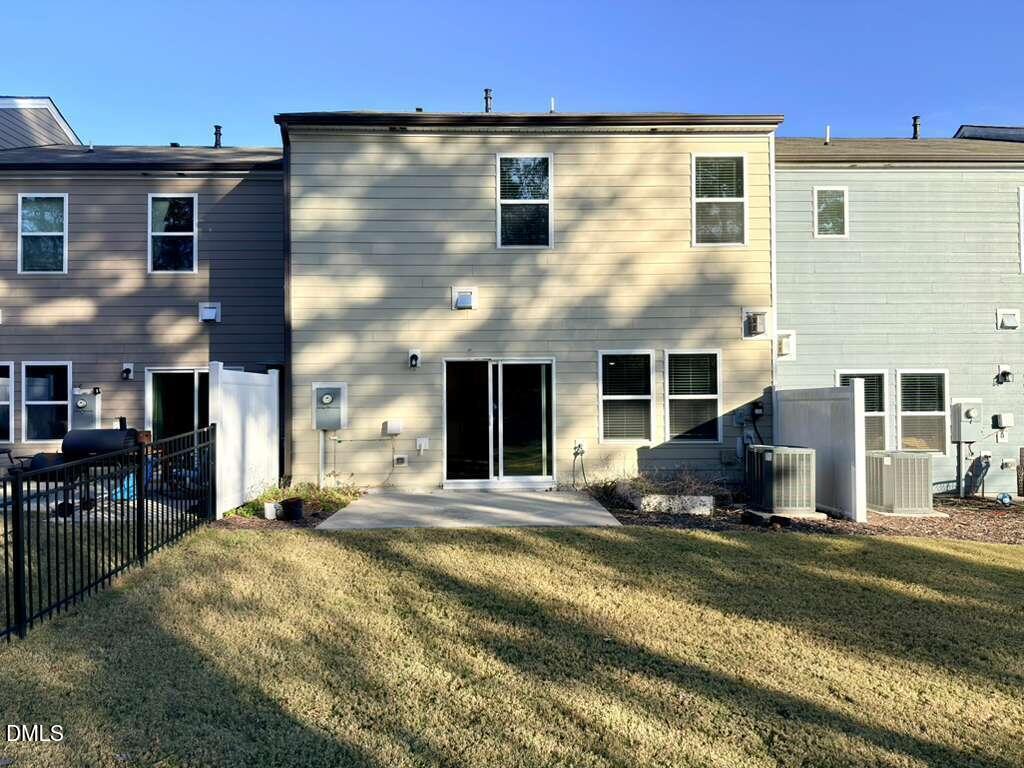 1152 Chestnut Bluff Run Apex, NC 27502 - Photo 34 of 35 a front view of a house with a yard