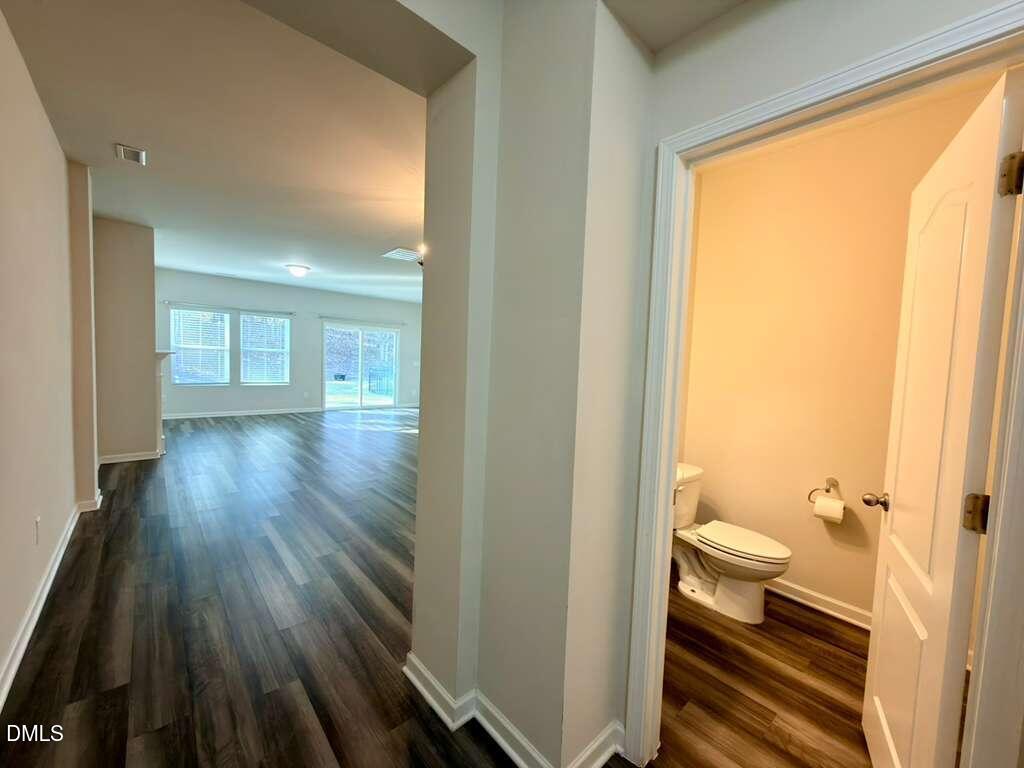 1152 Chestnut Bluff Run Apex, NC 27502 - Photo 5 of 35 a bathroom with a toilet