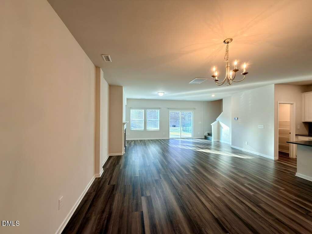 1152 Chestnut Bluff Run Apex, NC 27502 - Photo 7 of 35 a view of a room with wooden floor