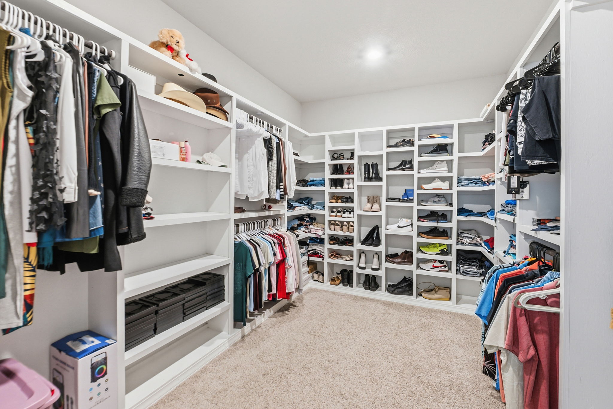 142 Brunnen Way Georgetown, TX 78626 - Photo 13 of 22 Ample shelving and hanging space defines this highly functional, walk-in closet.