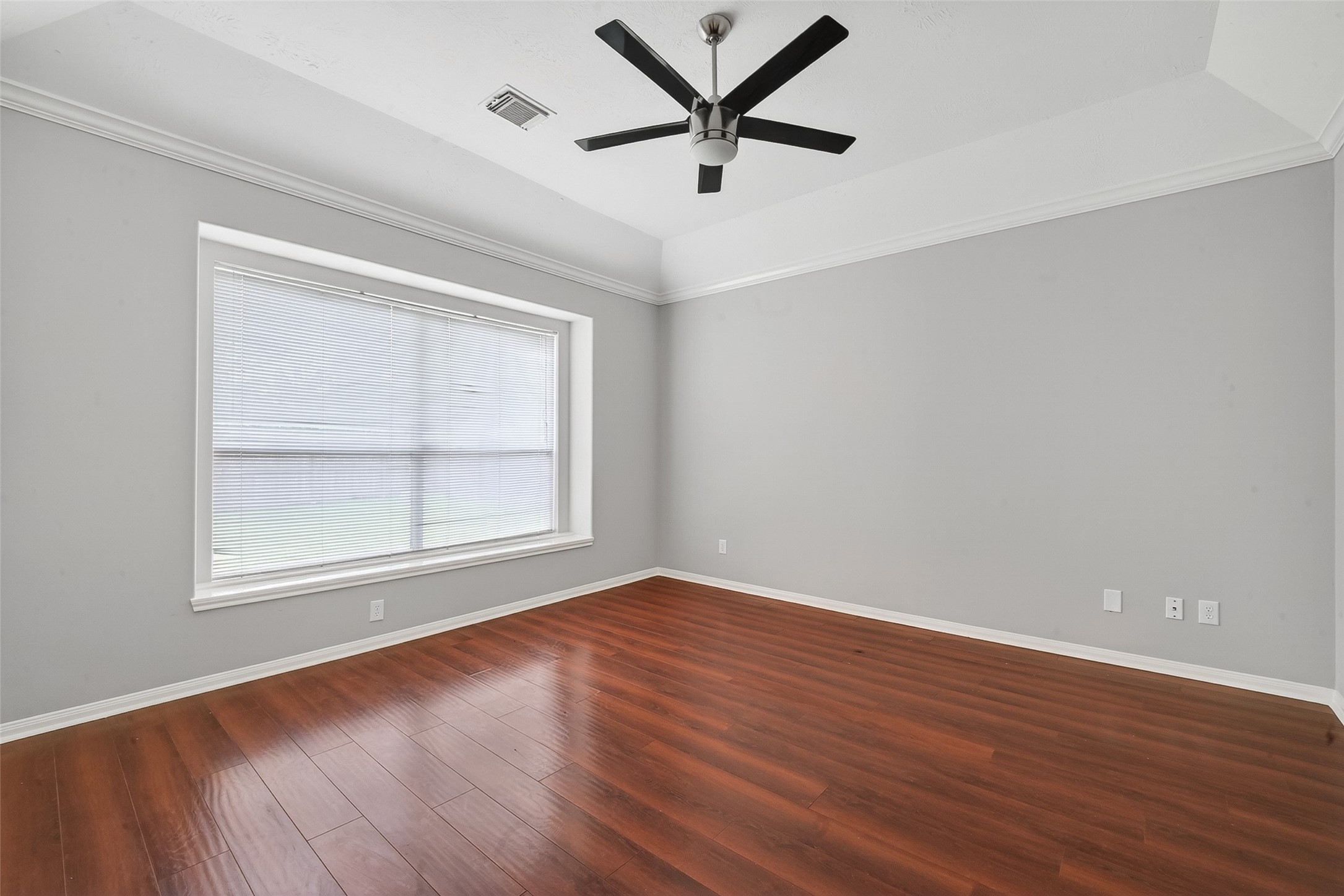 14308 Rocky Briar Lane Rosharon, TX 77583 - Photo 26 of 46 an empty room with wooden floor and windows