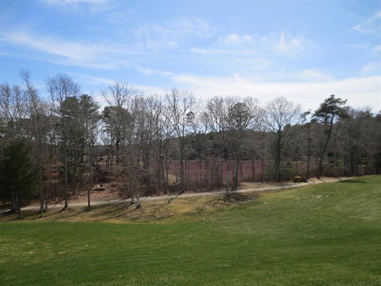 26 Prestwick Road, Unit 186 Bourne, MA 02532 - Photo 32 of 35 a view of a backyard