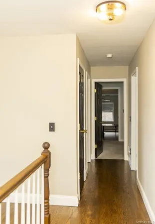 a view of a hallway with a room