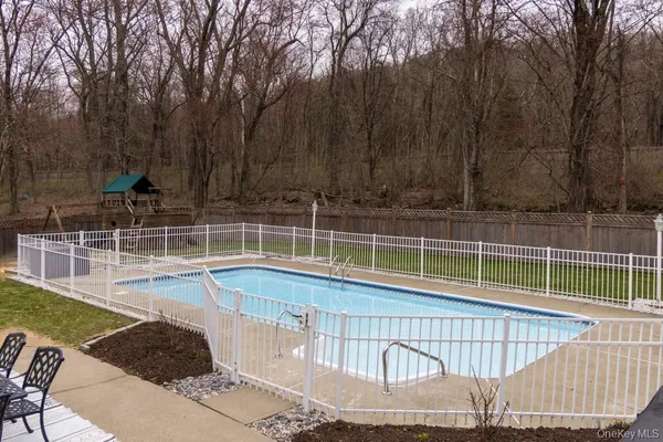 a view of a swimming pool with a backyard