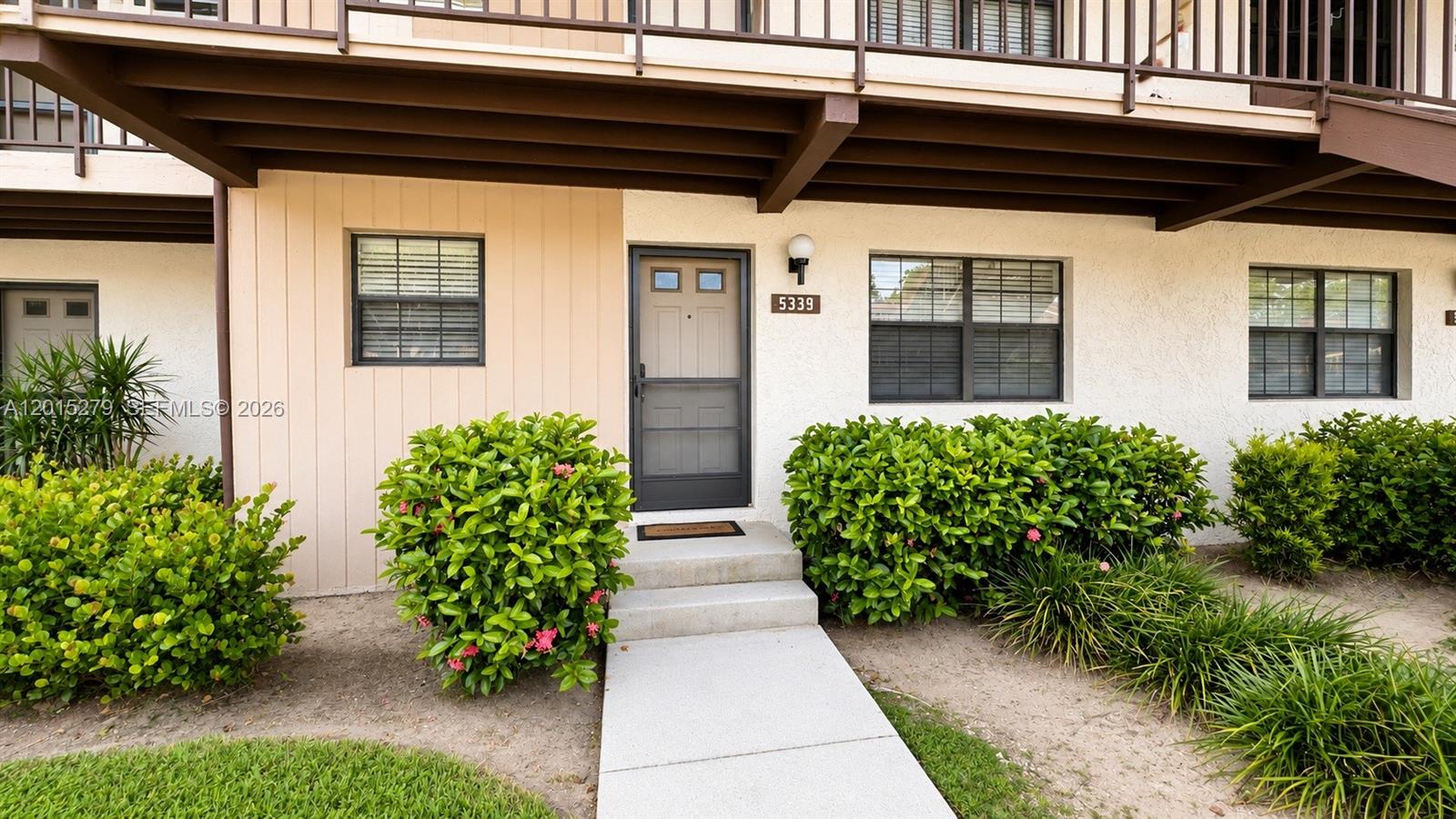 5339 Treetops Drive, Unit 5339 Naples, FL 34113 - Photo 17 of 20 a view of bunch of flowers in front of house