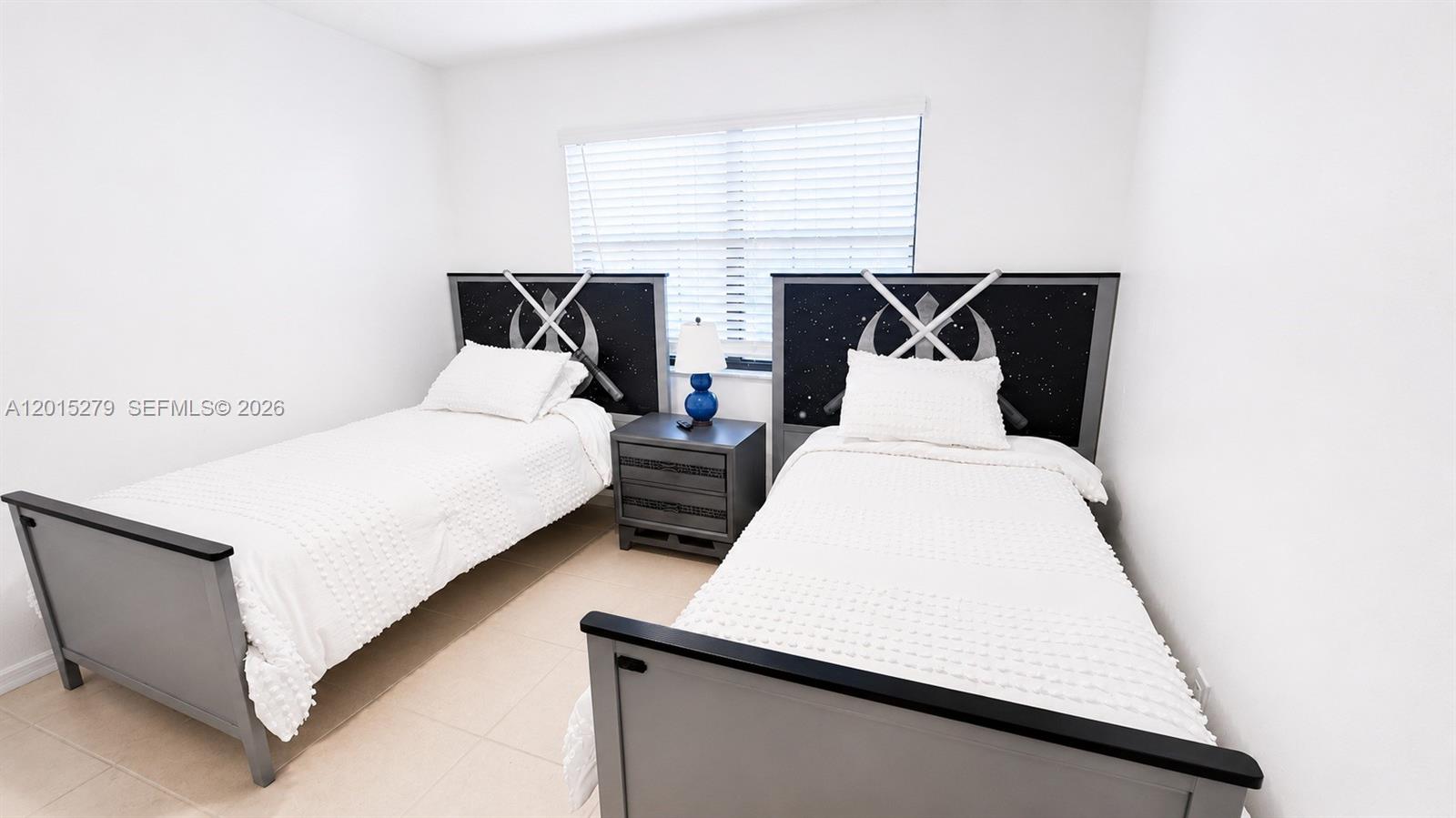 5339 Treetops Drive, Unit 5339 Naples, FL 34113 - Photo 6 of 20 a bed room with a bed and window
