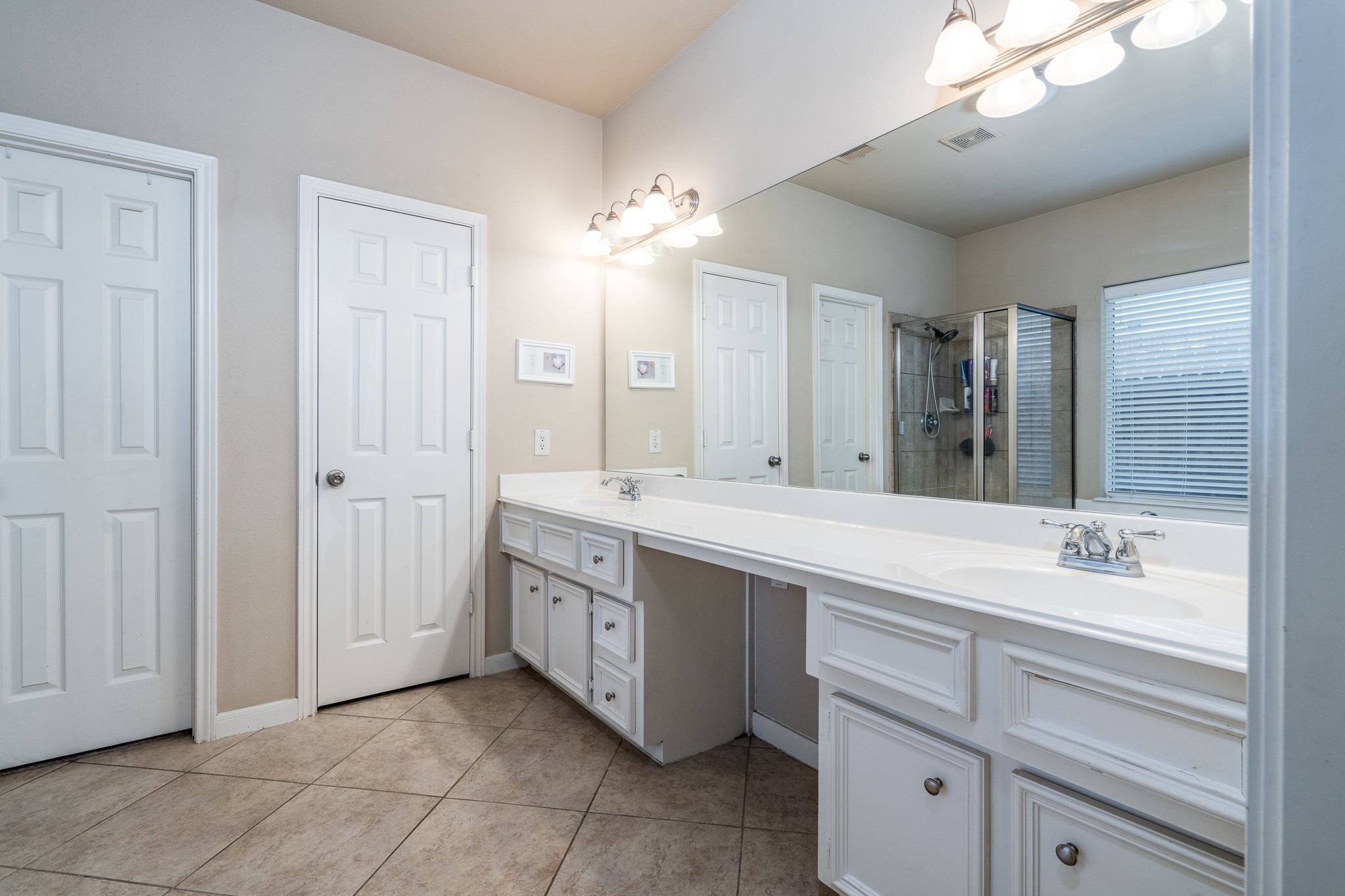 907 Colorado Springs Court Spring, TX 77373 - Photo 15 of 34 The primary bathroom has two sinks and room for a makeup chair.