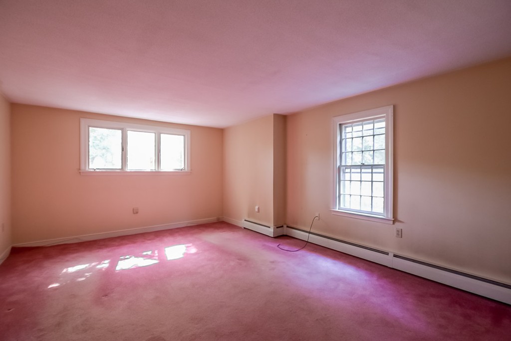 413 Harvard Road Bolton, MA 01740 - Photo 20 of 25 an empty room with windows