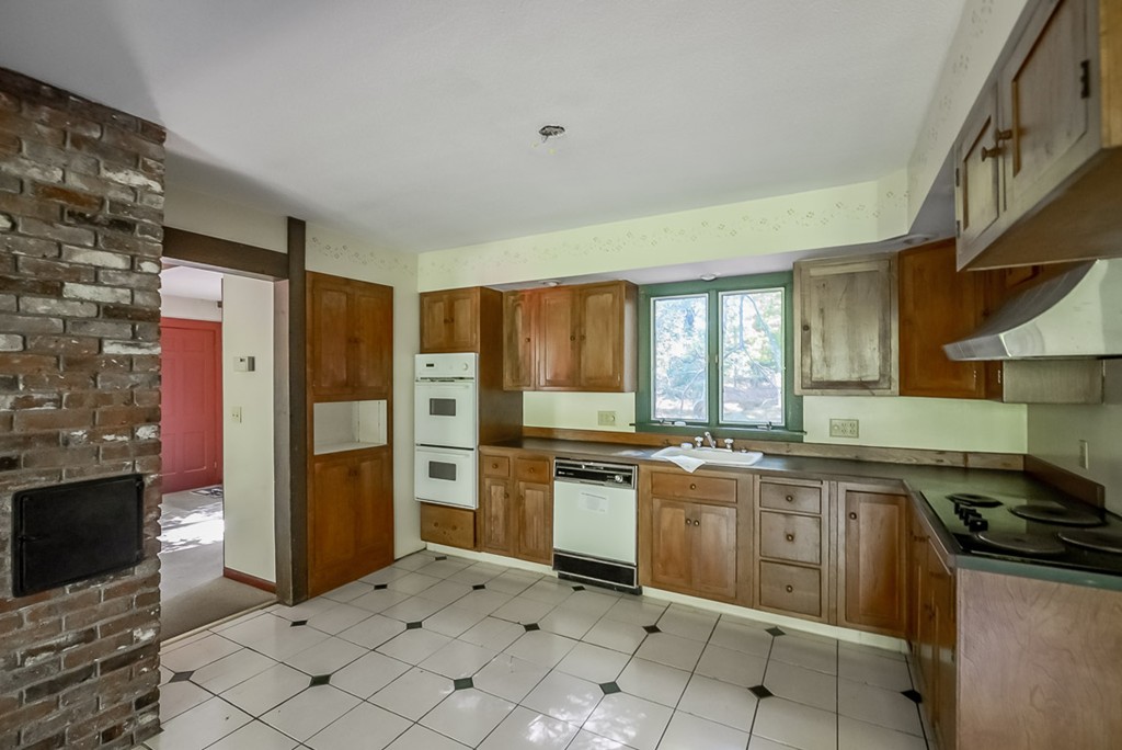 413 Harvard Road Bolton, MA 01740 - Photo 3 of 25 a kitchen with stainless steel appliances granite countertop a stove a sink and a refrigerator