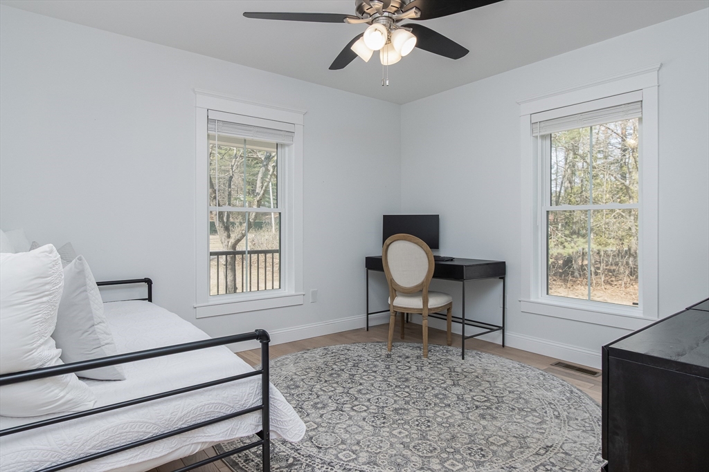 5 Mill Street Dunstable, MA 01827 - Photo 18 of 42 a living room with furniture a dining table and chair with windows