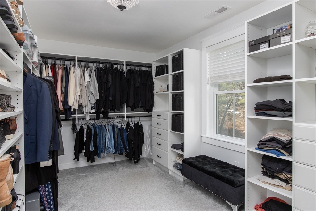 5 Mill Street Dunstable, MA 01827 - Photo 23 of 42 a view of walk in closet with clothes and shoes