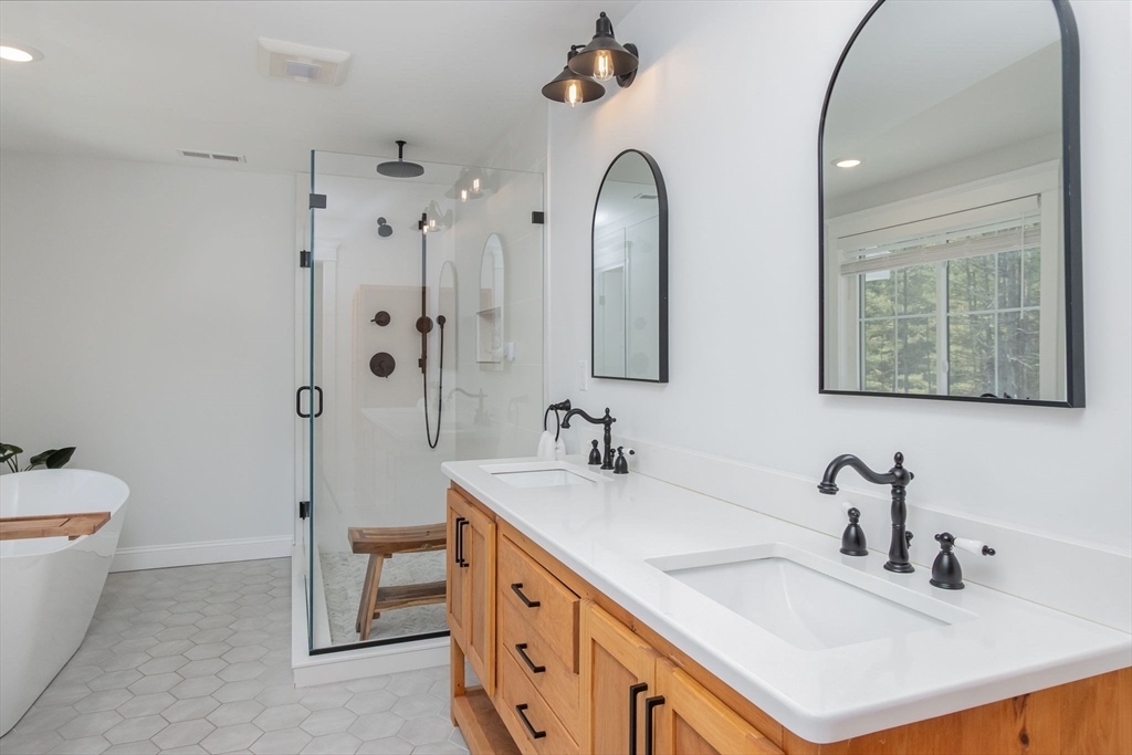5 Mill Street Dunstable, MA 01827 - Photo 25 of 42 a bathroom with a double vanity sink mirror and bathtub