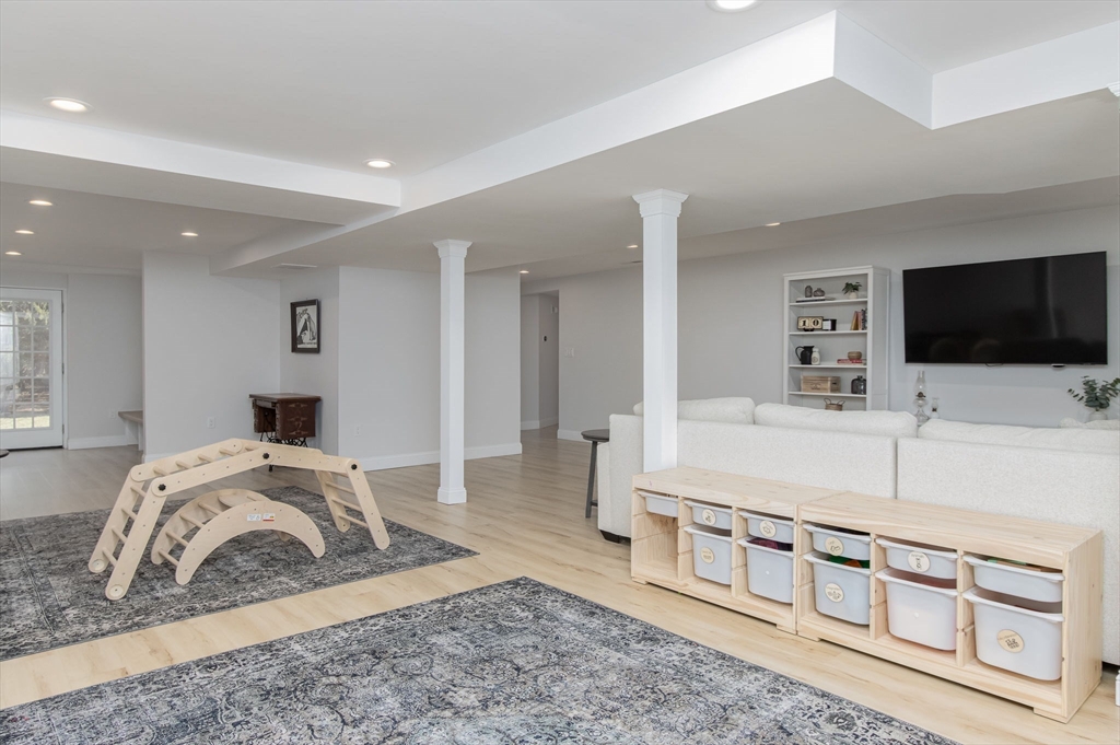 5 Mill Street Dunstable, MA 01827 - Photo 35 of 42 a living room with furniture and a flat screen tv