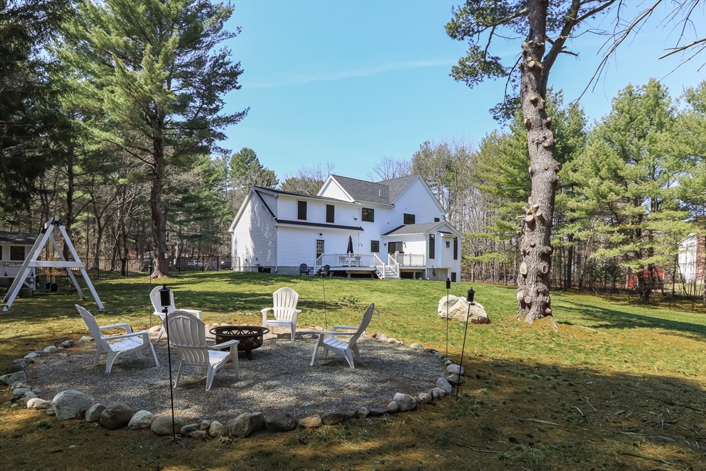 5 Mill Street Dunstable, MA 01827 - Photo 39 of 42 a swimming pool with outdoor seating and yard