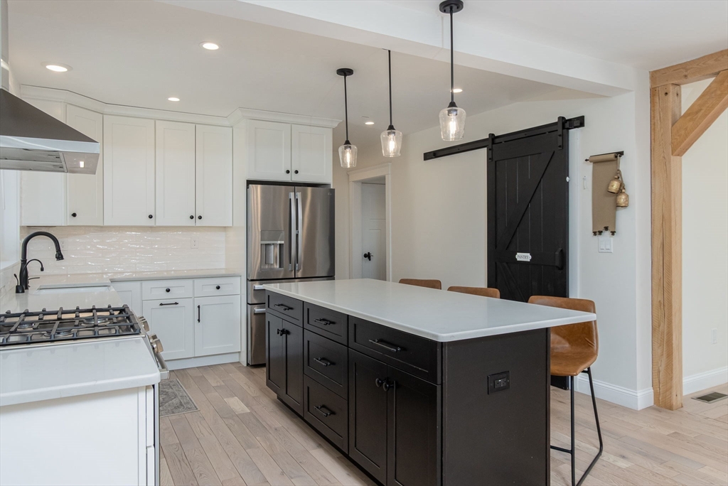 5 Mill Street Dunstable, MA 01827 - Photo 6 of 42 a kitchen that has a lot of cabinets in it and stainless steel appliances