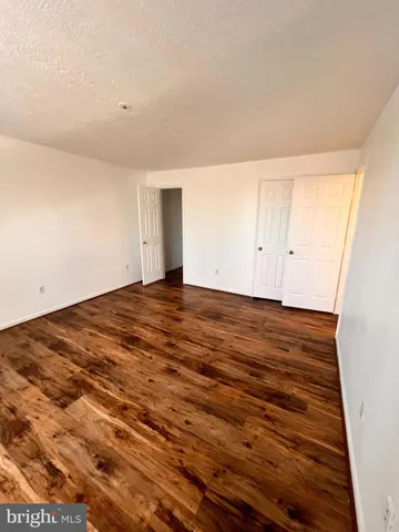 a view of room and wooden floor