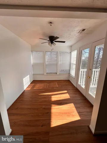 a view of entryway with wooden floor