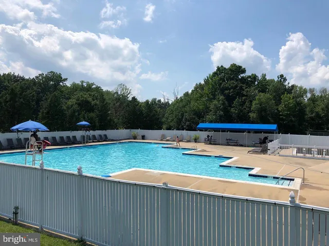 a view of a swimming pool with a patio