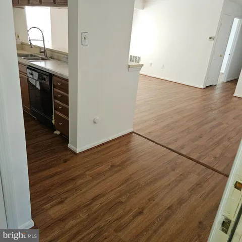 a view of a kitchen from the hallway