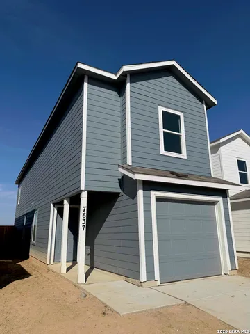a front view of a house with large windows