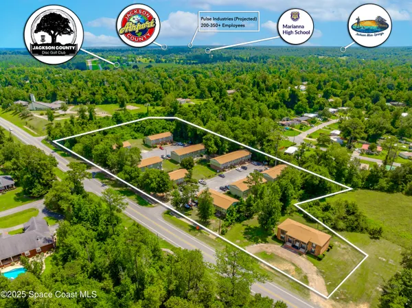 an outdoor space with lots of white furniture