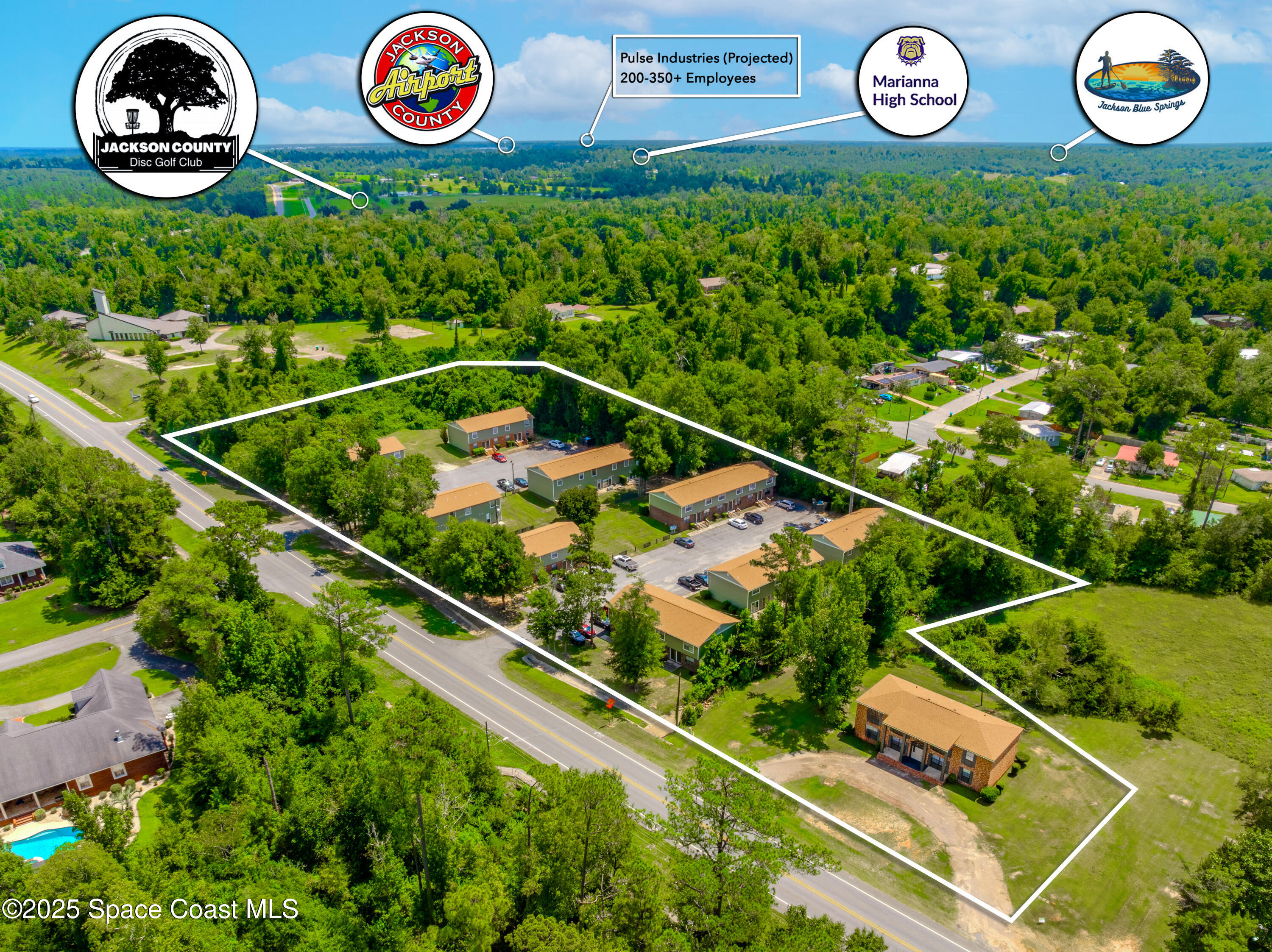 an outdoor space with lots of white furniture