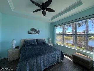 a bedroom with a large bed and a large window