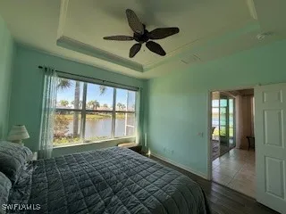 a bed room with a bed and a large window