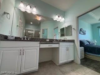 a bathroom with a sink and a mirror