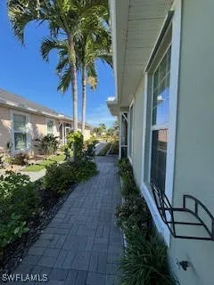 a couple of flower plants in front of door