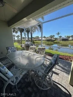 a view of a swimming pool with outdoor seating