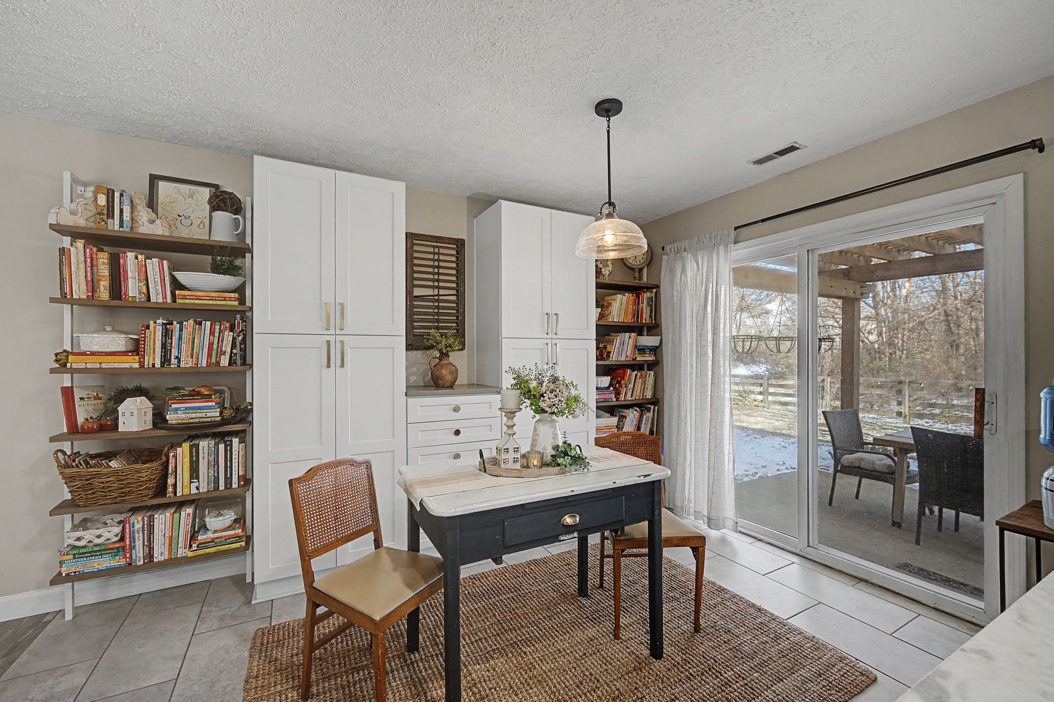 1038 Lexington Farms Drive Spring Hill, TN 37174 - Photo 17 of 34 a view of a dining room with furniture window and wooden floor