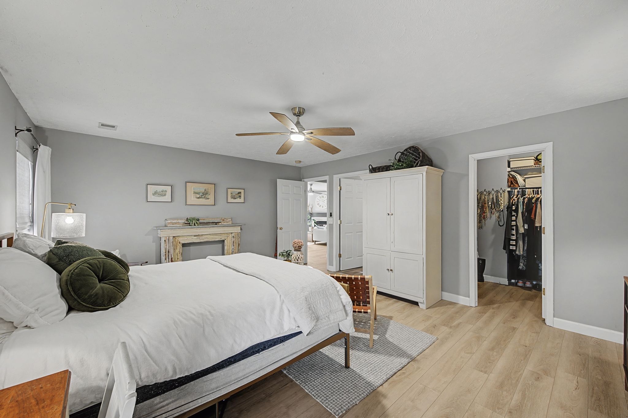 1038 Lexington Farms Drive Spring Hill, TN 37174 - Photo 19 of 34 a bedroom with a bed and a chandelier