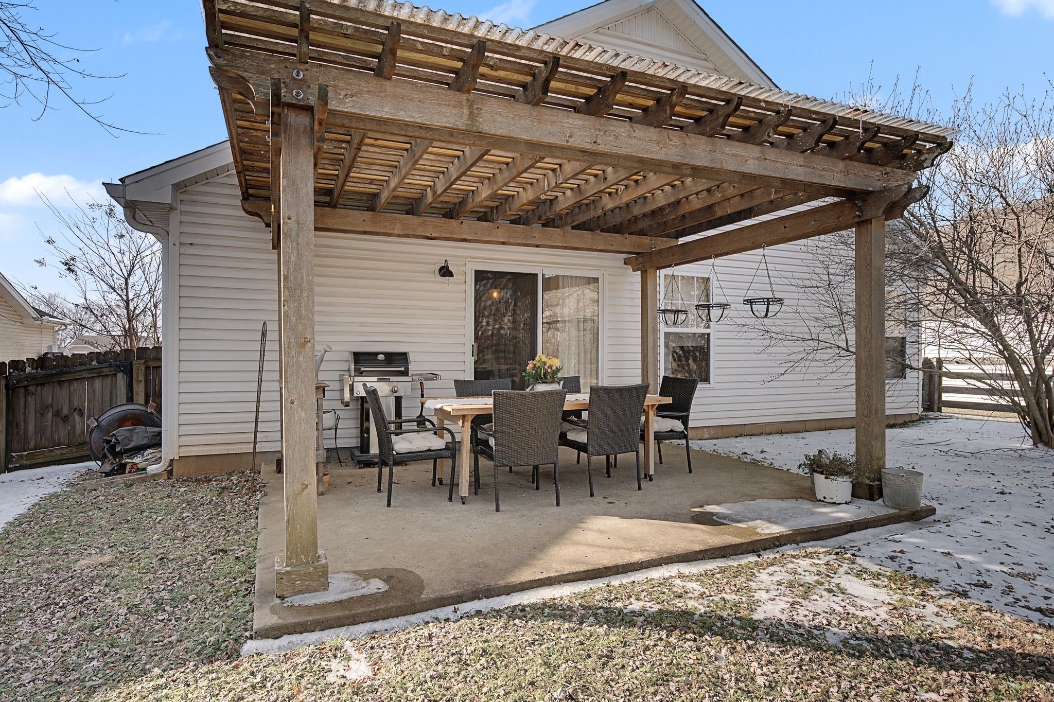 1038 Lexington Farms Drive Spring Hill, TN 37174 - Photo 24 of 34 a view of a dinning table and chairs in the patio
