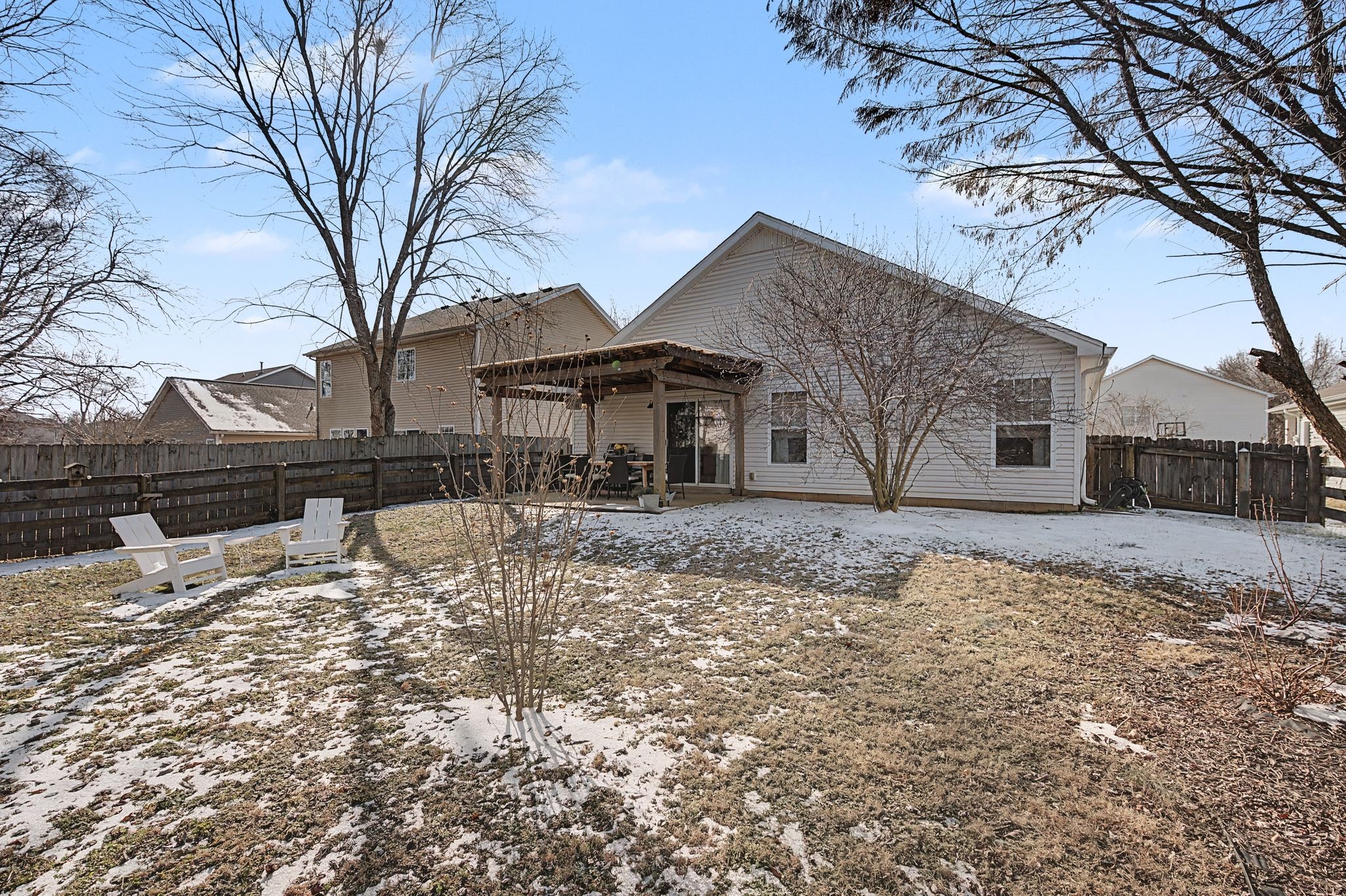 1038 Lexington Farms Drive Spring Hill, TN 37174 - Photo 29 of 34 a front view of a house with a yard covered in snow