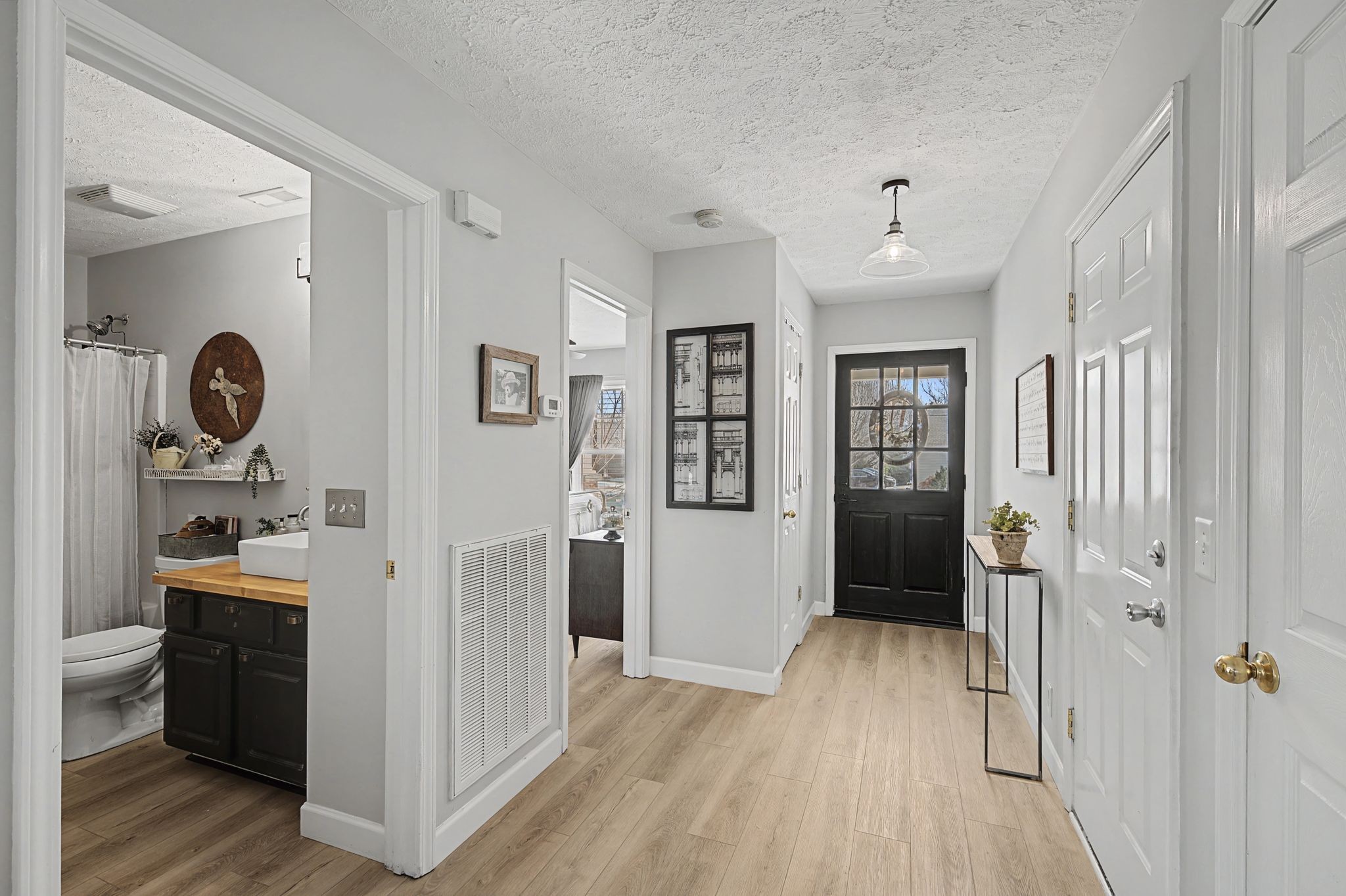 1038 Lexington Farms Drive Spring Hill, TN 37174 - Photo 6 of 34 a view of entryway with wooden floor and cabinets