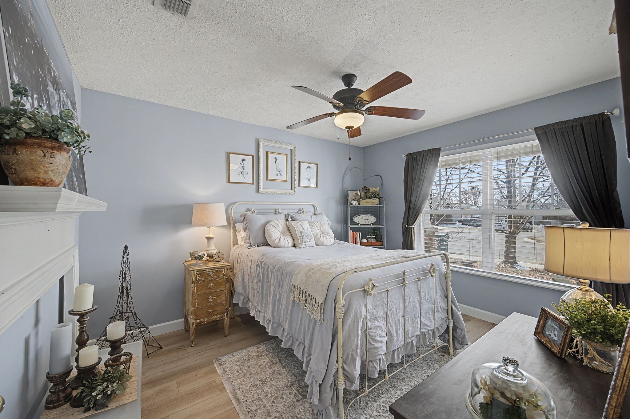 1038 Lexington Farms Drive Spring Hill, TN 37174 - Photo 7 of 34 a bedroom with a large bed and a large window