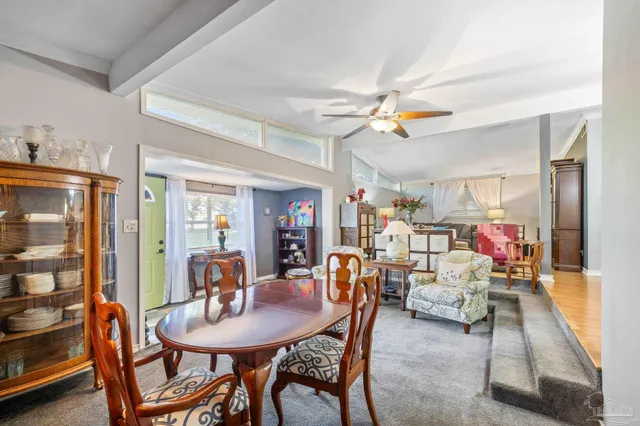 a bedroom with furniture and a chandelier