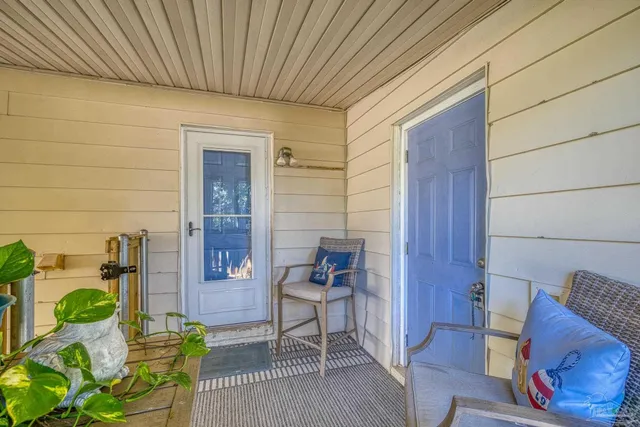 a front view of a house with a garden and patio