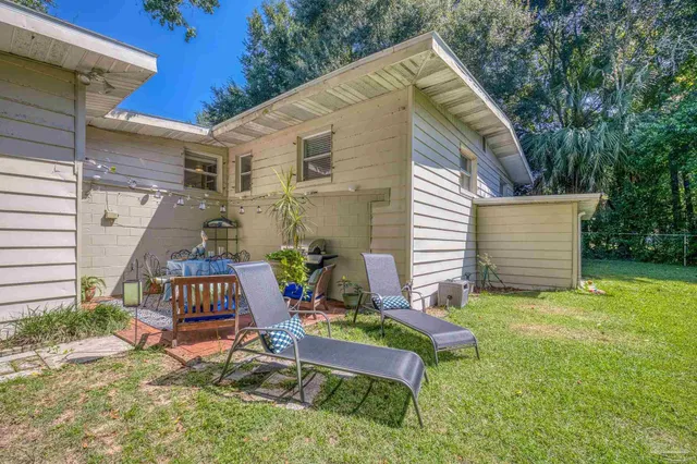 an aerial view of a houses with a lake view