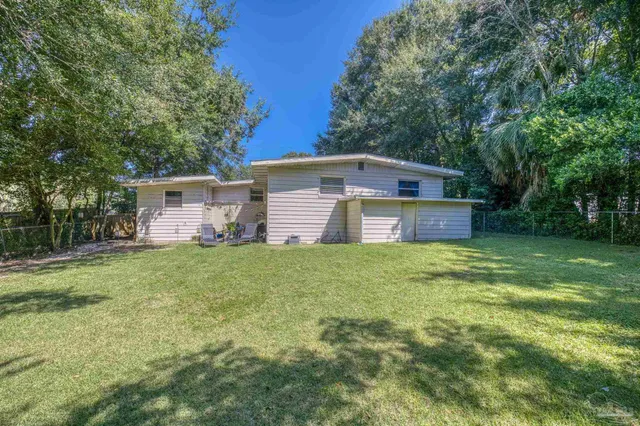 a room with chairs and wooden floor